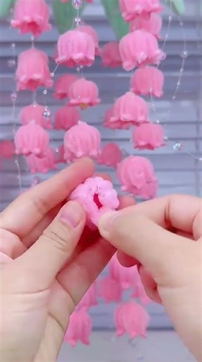 the process of making decorations from feather threads that form flowers