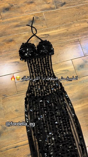 Stunning Black Sequined Dress Displayed Elegantly