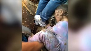 Watch moment police find crying child underneath rubble of a home blast