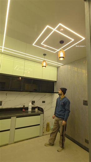 Maddy designer's on Instagram: "Completed 10x10 Modular kitchen design! ✨ Acrylic finish, ceiling working profile lighting, magic corner, soft-close glass pantry, Innotech fittings, glass profile doors, and fluted wall panel. 🤩 #Kitchen #Design #Home#viralreels #instagram #allhamdulillah #facebook"