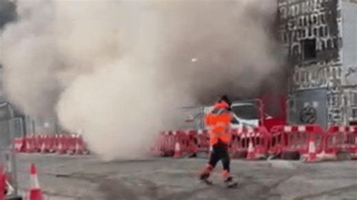 Terrifying moment building COLLAPSES on cars after workers felt it 'wobble'