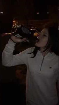 Girl drinking 1 full bottle of alcohol