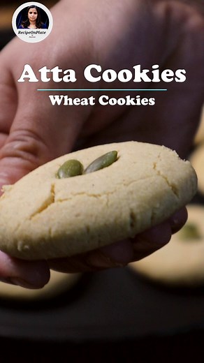 Atta cookies Recipe / Wheat Cookies Recipe Ingredients for 12 pieces of atta cookies Wheat flour – 2/3 cup Gram flour – 1 tbsp Corn flour – 1 tsp Powdered sugar – 3 tbsp Ghee – 1/3 cup Cardamom powder – ¼ tsp Baking soda – ¼ tsp Milk powder – 1 tbsp Pumpkin seeds – 2 tbsp 1. Firstly take ghee and powdered sugar into a mixing bowl. Then mix them together to make a fluffy & creamy batter. 2. After that add all the dry ingredients like wheat flour, gram flour, corn flour, cardamom powder & baking s