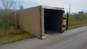 Accident flips box truck, sends three people to hospitals
