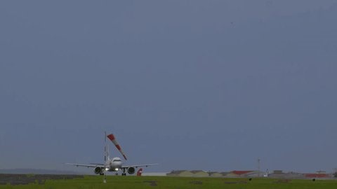 clip-3996711521-large-commercial-airplane-taking-off-airport-runway