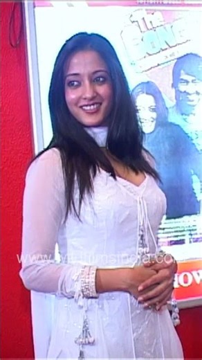 Raima Sen at a promotional event showcasing her poised presence as she interacts with the media