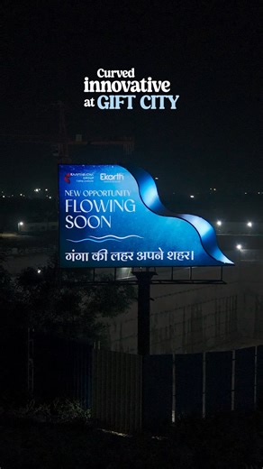 Craywingz - Ad Agency on Instagram: "You’ve seen square, circle, and rectangle hoardings. But never one that flows 🌊 Presenting India’s first curved backlit LED hoarding a design that moves with the city’s rhythm. For Kaavyaratna Group | Project Ganga, GIFT City. Outdoor innovation by Craywingz. #MakingAdvertisingGreatAgain #craywingz"