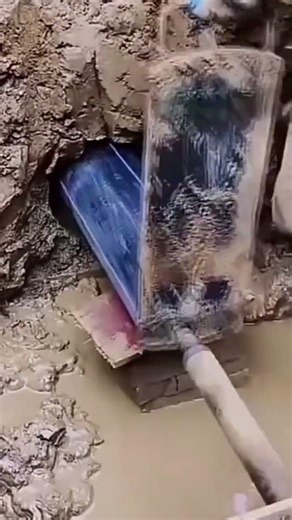 The process of installing a large pipe in the construction area by a craftsman