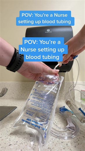 Nurse Setting Up Blood Tubing Guide