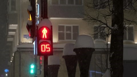 clip-3993838819-red-pedestrian-traffic-light-countdown-heavy-winter
