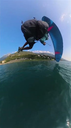 Paraglider landing fast over water in Lake Garda, Italy!