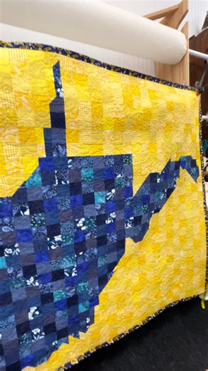 A large pixelated West Virginia quilt, finished with the Almost Heaven stitch-out. I added the binding right here in the studio, and the batting and backing both came from my stash. Another beautiful Mountain State quilt headed home soon. #AlmostHeaven