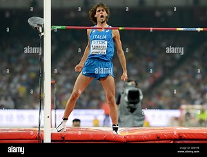 Italy's Gianmarco Tamberi in action in the Men's High Jump during day nine of the IAAF World Championships at the Beijing National Stadium, China. PRESS ASSOCIATION Photo. Picture date: Sunday August 30, 2015. See PA story ATHLETICS World. Photo credit should read: Martin Rickett/PA Wire. RESTRICTIONS: No transmission of sound or moving images and no video simulation. Call 44 (0)1158 447447 for further information Stock Photo - Alamy