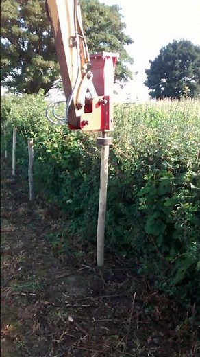 Post knocker on mini digger