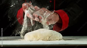 Super slow motion of chef clapping hands above yeast dough. Filmed on high speed cinema camera, 1000 fps.