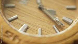 Close up of clock and ticking hand counting down the seconds