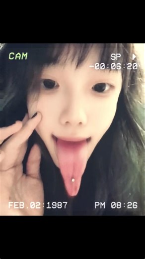 Changing her tongue piercing