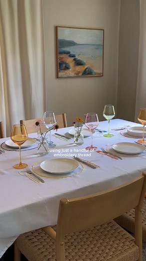 Angie Gibson on Instagram: "🎨 DIY in a Day FAVORITE TABLECLOTH 🩷❤️🧡💛💚🩵💙 Comment “link” and I’ll dm you a link to the materials I used!! Hand stitched, and totally customizable! This $10 cloth turned into the most colorful tablescape 🧵🌈 What do you guys think? Inspired by @pinterest #crafts #embroidery #splitstitch #handmadegifts #hosting #tableware #tablescape"