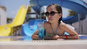 Female Child Drinking Cocktail Pool Stock Footage Video (100% Royalty-free) 10406243 | Shutterstock