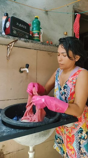 Hand-Washing Clothes in a Colorful Kitchen Setting