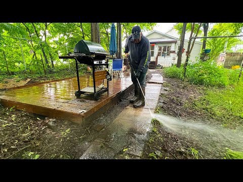 Transforming an overgrown backyard: Satisfying pressure washing makeover!