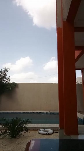 Exploring Tradition: A Man in Blue Robe Outdoors