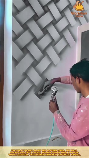 Skilled Worker Spray Painting Geometric Wall Patterns for Artistic Interior Finishing