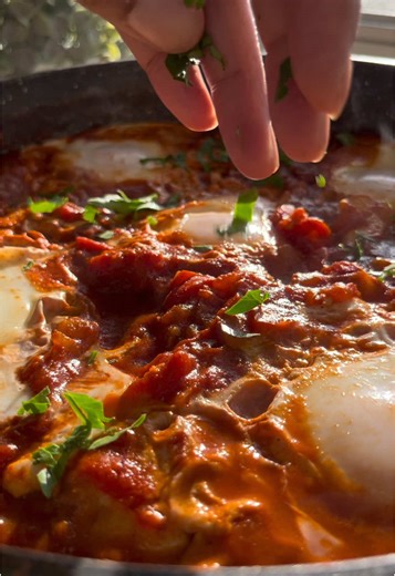 shakshuka 🍅🍳 - this recipe is one of my go-to quick meals. It is so easy to make and is packed with a rich mix of enticing flavors thanks to a savory tomato sauce infused with spices like paprika and cumin. oh, and let me not forget my favorite part to this dish - the gooey, runny eggs! so much goodness in each bite!! what you’ll need: • 2 tbsp olive oil • 1 medium onion, chopped • 1 red bell pepper, chopped • 4 garlic cloves, minced • 1 tsp smoked paprika • 1/2 tsp cumin • 1/8 tsp cayenne pep