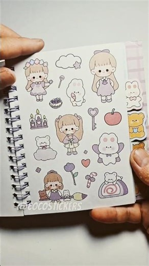 Playing with cute girl sticker puzzles.
