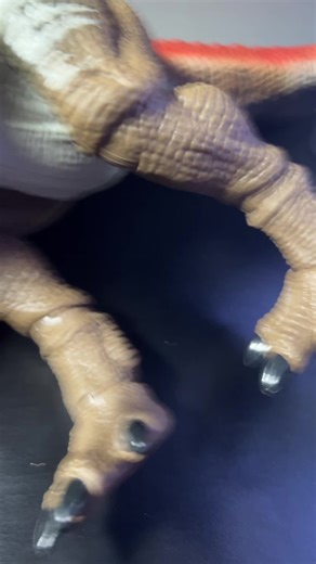 Action Figures Posing: Spinosaurus and Optimus Prime