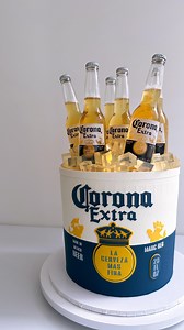 9.2K views · 164 reactions | Super excited to share this Corona beer cake we made for last night party. The cake itself is a 12x12 inch big boy, with a chocolate cylinder on the outside to hold everything together. Instead of placing the beer inside, we set it on top of the sponges , surrounded by jelly ‘ice’ for that extra touch. Hope you enjoy it as much I do. ☺️ | K CAKE | Facebook