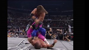 Bret Hart showing Chris Benoit that he isn't the boss of him now and he's not so big.