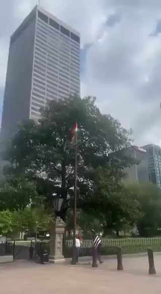 Indians in Ohio take down the American flag and put up the Indian flag in its place.