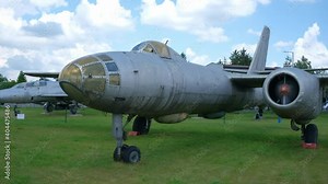 Old jet fighter aircraft in open-air military museum. Military aircrafts concept.