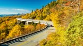 A Vehicle and a Motorcycle Driving on the Iconic Linn Cove Viaduct...