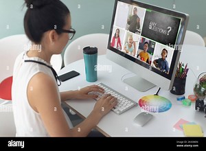 Caucasian girl using laptop for video call, with smiling diverse elementary school pupils on screen. communication technology and online education, di Stock Photo - Alamy