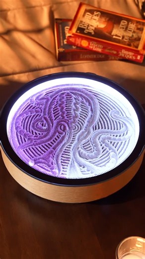 Grounded Labs on Instagram: "Deep sea magic in purple and silver sparkle 🐙 The Oasis Mini captures a mystical octopus, each graceful tentacle emerging through shimmering glitter sand like an underwater galaxy. Watch as eight flowing arms and intelligent form unfold in iridescent detail. Shipping now - the perfect gift for ocean lovers and dreamers alike!"