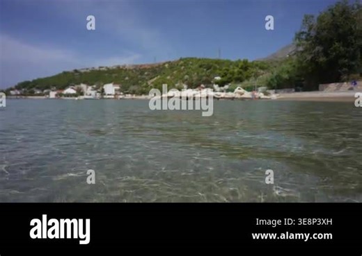 Sea waves washing over sandy beach with crystal water Stock Video Footage - Alamy