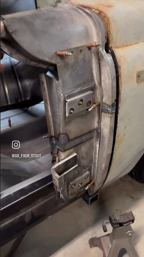Using part of the original door hinge structure and cutting and sectioning it to fit.