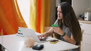 Online shopping.Girl woman using laptop and credit card makes online purchases in online stores.Money from credit card shopping.Shopping online payment for goods credit. business girl with credit card