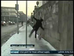 Man slipping on ice in Dublin - RTE News - EPIC FAIL!.flv