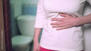 Pain in the stomach of a woman, diarrhea, goes to the toilet.