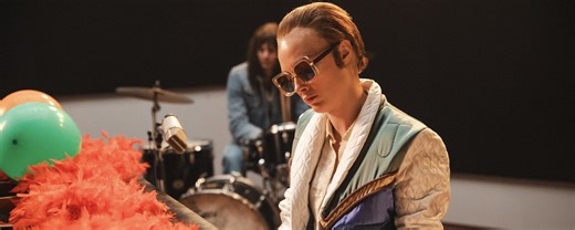 Watch Cara Delevingne Portray Elton John in New Video for Elton’s Classic Holiday Single “Step into Christmas”