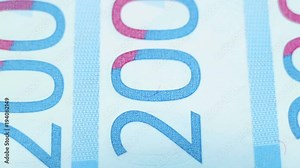 Banknotes close-up. Protection against forgery. Blue paper money. Smooth rotation and shallow depth of field. Numbering.