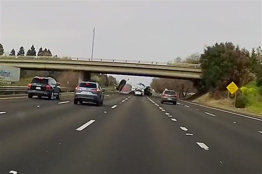 Car launches off California overpass onto busy interstate highway