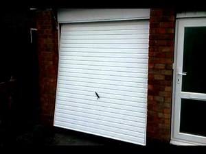 Opening a Newly Fitted Novoferm Naseby Up & Over Door, in High Lane.