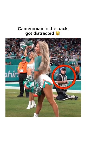 Playmaker Zone ⚡️ on Instagram: "During last night’s football game, a trending clip captured a hilarious behind-the-scenes moment: the cameraman was busy fixing his camera when he suddenly got distracted by a cheerleader on the sidelines. For a few seconds, he completely lost focus, juggling the camera while sneaking glances, and the chaos was caught live on tape. Fans quickly shared the clip, laughing at the awkward but relatable moment—proof that even pros can get distracted when the action is