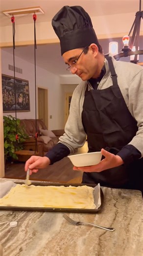 Sheetal Nidimoru on Instagram: "Every year, Benoit makes a vegan king cake on Jan 6th. January 6th comes from a French Catholic tradition, Epiphany, marked by the King Cake, but in our home it has become something living and intentional. In multicultural families, culture isn’t something we inherit rigidly, it’s something we practice consciously. A man who carries tradition lightly, with humor, food, and ease, passes it on without force. That’s how faith becomes lived, not taught. And that’s how