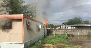Crews put out northwest side mobile home fire