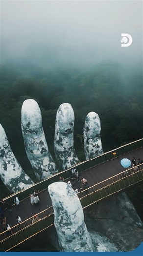 Walk a bridge that looks like it’s held up by the gods.​ ​ Opened in 2018, Vietnam’s Golden Bridge was designed to resemble divine hands raising a golden thread from the mountains, creating one of the world’s most surreal walkways. #DiscoveryChannelSoutheastAsia #GoldenBridgeVietnam #Vietnam #BaNaHills #SoutheastAsia | Discovery Channel Southeast Asia